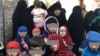 Таджикские женщины с детьми в Ираке. 
