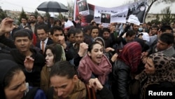 Members of civil society organizations chant slogans during a protest to condemn the killing of Farkhunda on March 24.
