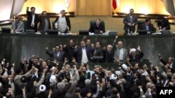 Members of parliament shout slogans calling for the execution of opposition leaders Mir Hossein Musavi and Mehdi Karrubi.