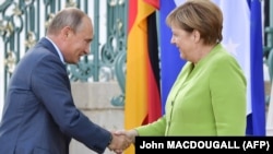 Vladimir Putin i Angela Merkel