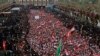 Followers of Shiite cleric Moqtada Al Sadr chant slogans against corruption, the U.S. and Israel during demonstrations while gathering between the holy shrines of Imam Hussein and Imam Abbas on the Arbaeen Shiite gathering in Karbala, Iraq, Saturday, Oct. 19. 2019