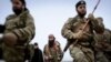 Scena iz propagandnog filma IDIL-a u kojoj se pojavljuju militanti sa Balkana