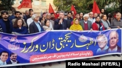 FILE: Journalists and civil society leaders protest the harassment of journalists working for Dawn, a leading English language daily in December.