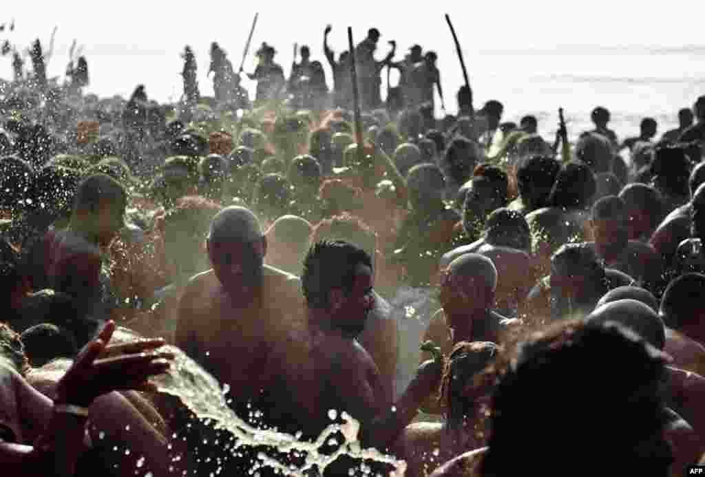 Hindus bathe in the waters of the Sangam in Allahabad, India during the Maha Kumbh religious festival. (AFP/Manan Vatsyayana)