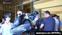 Armenia -- NSS officers confiscate documents from Yerevan's municipal administration bulding, 13 June, 2018.