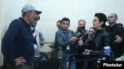 Armenia - Opposition leader Nikol Pashinian (L) argues with a senior Public Radio executive after seizing the radio building in Yerevan, 14 April 2018.