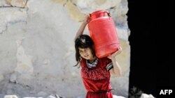A Syrian girl in the Kallaseh district of the northern city of Aleppo on July 5. 