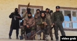 A photo of Tajik militants who reportedly took up arms in parts of Syria and Iraq. (file photo)