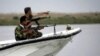 Iraqi coast guards patrol the waters of the Shatt Al-Arab waterway.