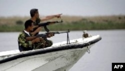 Iraqi coast guards patrol the waters of the Shatt Al-Arab waterway.