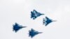 Four Sukhoi Su-57 fifth-generation fighters perform during the opening ceremony of the MAKS 2019 International Aviation and Space Salon in Zhukovsky outside Moscow on August 27.