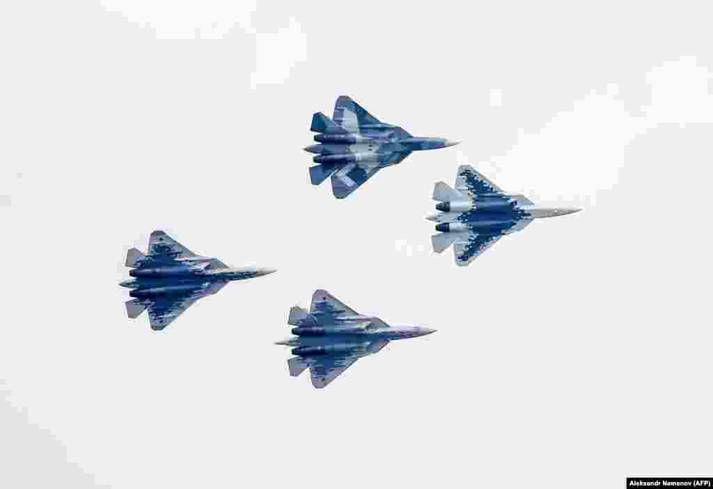 Four Sukhoi Su-57 fifth-generation fighters perform during the opening ceremony of the MAKS 2019 International Aviation and Space Salon in Zhukovsky outside Moscow on August 27.