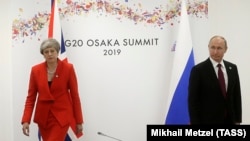 British Prime Minister Theresa May and Russian President Vladimir Putin meet on the sidelines of the G20 summit in Osaka.