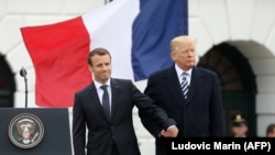 U.S. -- U.S. President Donald Trump and French President Emmanuel Macron shake hands during a state welcome at the White House in Washington, April 24, 2018