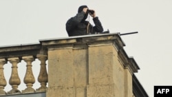 Germany -- A police sniper keeps watch from the roof of the Orangerie near Sanssouci Palace in Potsdam, 08Sep2010