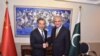 FILE: Pakistan's Foreign Minister Shah Mehmood Qureshi shakes hand with his Chinese counterpart Wang Yi.