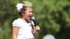 A girl sings at a Victory Day event in Bishkek, Kyrgyzstan.