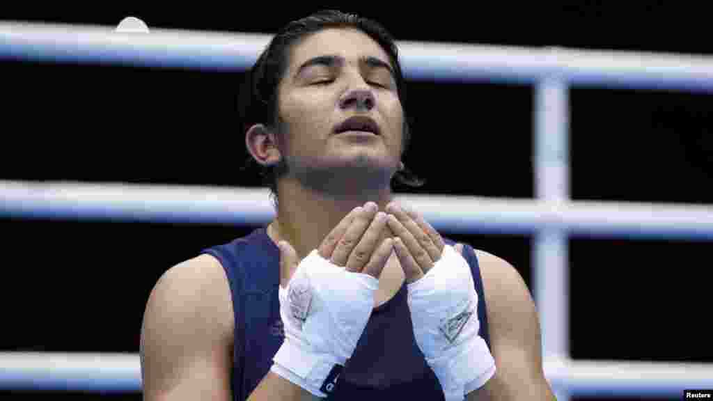 Tajikistan's Mavzuna Chorieva reacts after losing the women's light (60-kilogram) semifinal boxing match in London. (Reuters/Damir Sagolj)