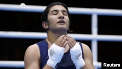 Mavzuna Chorieva reacts after losing the her semifinal boxing match at the London Olympic Games.