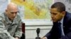 U.S. President Barack Obama is briefed by General Ray Odierno, commander of U.S. troops in Iraq, at Camp Victory in early April.