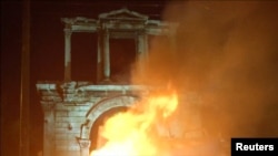 Fotografia este de la protestele din Atena din 2015 împotriva măsurilor de austeritate 