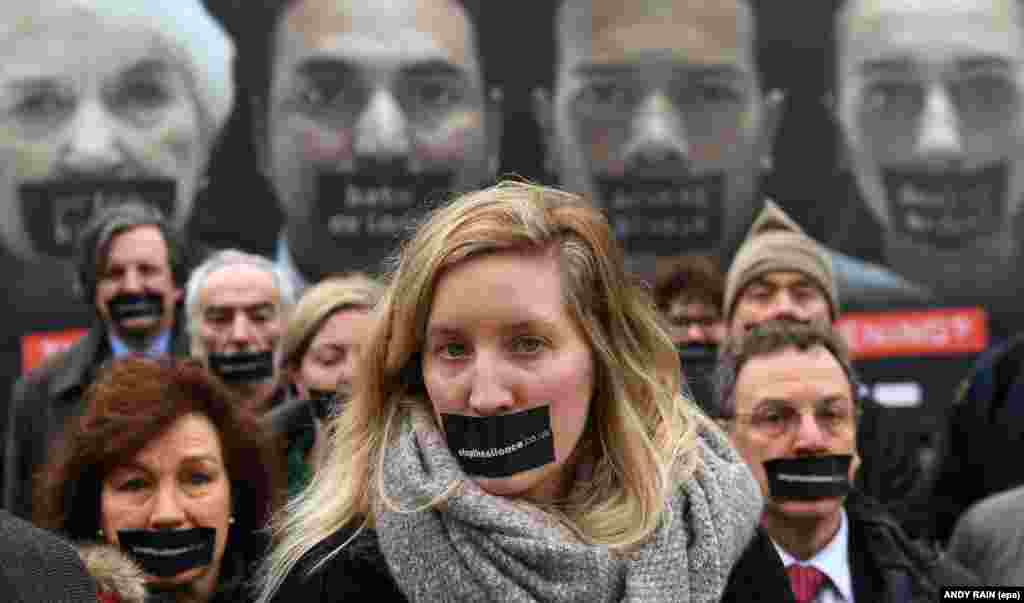 Stop The Silence campaigners launched a nationwide poster outside the British Parliament in London. They are calling for the House of Lords to make amendments to the Article 50 bill and for the public to speak out over the government's hard Brexit policy. (epa/Andy Rain)