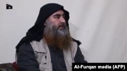 In this undated TV grab taken from a video released by Al-Furqan media, the chief of the Islamic State group Abu Bakr al-Baghdadi purportedly appears for the first time in five years in a propaganda video in an undisclosed location. April 2019