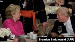 U.S. Democratic presidential nominee Hillary Clinton (left) shares a word with her Republican rival Donald Trump at the Alfred E. Smith Memorial Foundation Dinner in New York earlier this month. 