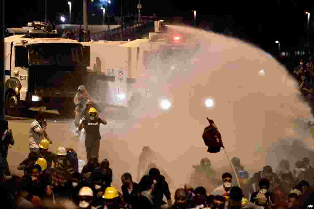 A riot police water cannon sprays demonstrators during clashes in Istanbul on June 4.