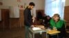 A young Georgian man casts his vote in Marneuli on October 28. 