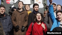 Protesters shout slogans on Moscow's Pushkin Square during a mass rally against corruption in the government on March 26.