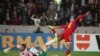 Юра Мовсисян в составе сборной Армении забивает гол в ворота соперника (архив)