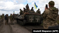 Ukrán katonák egy Limanhoz közeli úton 2022. október 4-én