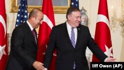U.S. Secretary of State Mike Pompeo (R) meets with Turkish Foreign Minister Mevlut Cavusoglu at the State Department in Washington, June 4, 2018