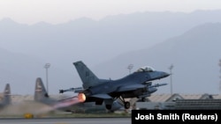 A U.S. Air Force F-16 Fighting Falcon aircraft takes off for a nighttime mission from Bagram Airfield in August.