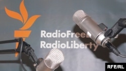 Microphones and RFERL logo on background