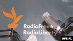 Microphones and RFERL logo on background