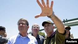 U.S. Secretary of Defense Ash Carter (left), Israeli Defense Minister Moshe Ya'alon (center), and Israeli Brigadier General Moni Katz view the Hula Valley from the Hussein Lookout near Kiryat Shmona in northern Israel on July 20.