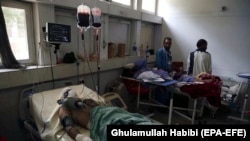 Afghan civilians injured in a suicide attack in the eastern Afghan city of Jalalabad are being treated in a local hospital in Jalalabad on September 11.