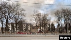 PHOTO GALLERY: Historic Mariupol Theater Hit By Air Strike