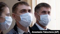 Members of the Jehovah's Witnesses attend a court session in Perm on April 27.