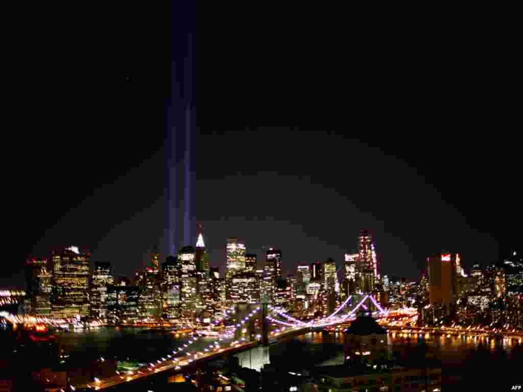 The "Tribute in Light" beams at New York City's Ground Zero are visible from Brooklyn during a test ahead of the anniversary of the 9/11 attacks on September 8. The light was first seen in March 2002. Photo by Chip Somodevilla for Getty Images/AFP