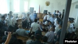 Armenia -- A chaotic scene at the trial of arrested members of an armed opposition group in Yerevan, 28 June, 2017.