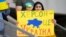 POLAND – Ukrainian fan with a poster "Kherson is Ukraine" before the UEFA League of Nations match between Ukraine and Armenia. Lodz, Poland, June 11, 2022