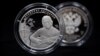New 25-ruble silver coins issued by Russia's Central Bank to mark the 80th birth anniversary of Russian poet, actor, singer, and songwriter Vladimir Vysotsky