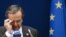 Greek Prime Minister Antonis Samaras adjusts his glasses at a two-day EU leaders summit in Brussels in October, 2012.