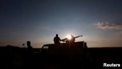 A Popular Mobilisation Forces (PMF) fighter rides in a military vehicle at the Iraqi-Syrian border near al-Qaim, Iraq, November 26, 2018. Picture taken November 26, 2018. REUTERS/Alaa al-Marjani