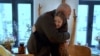 Dr. Borys Tudorov hugs Kira, a young heart-transplant patient.