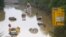 Submerged cars and other vehicles are seen on the federal highway B265 in Erftstadt, western Germany, on July 17, 2021,