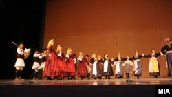 Macedonian folk dancers in folk costumes.